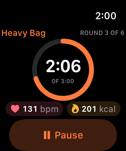 Mak on Apple Watch during a heavy bag workout: round 3 of 6, 2:06 left of 3:00 in an orange ring, heart rate 131 bpm and 201 active calories, with a Pause button.